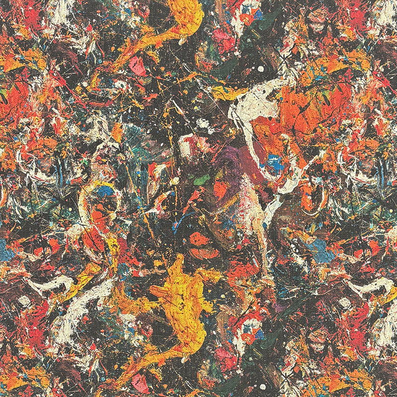 Statement upholstery fabric with dense multicoloured paint splatter pattern in orange, red, yellow and blue on a dark textured background