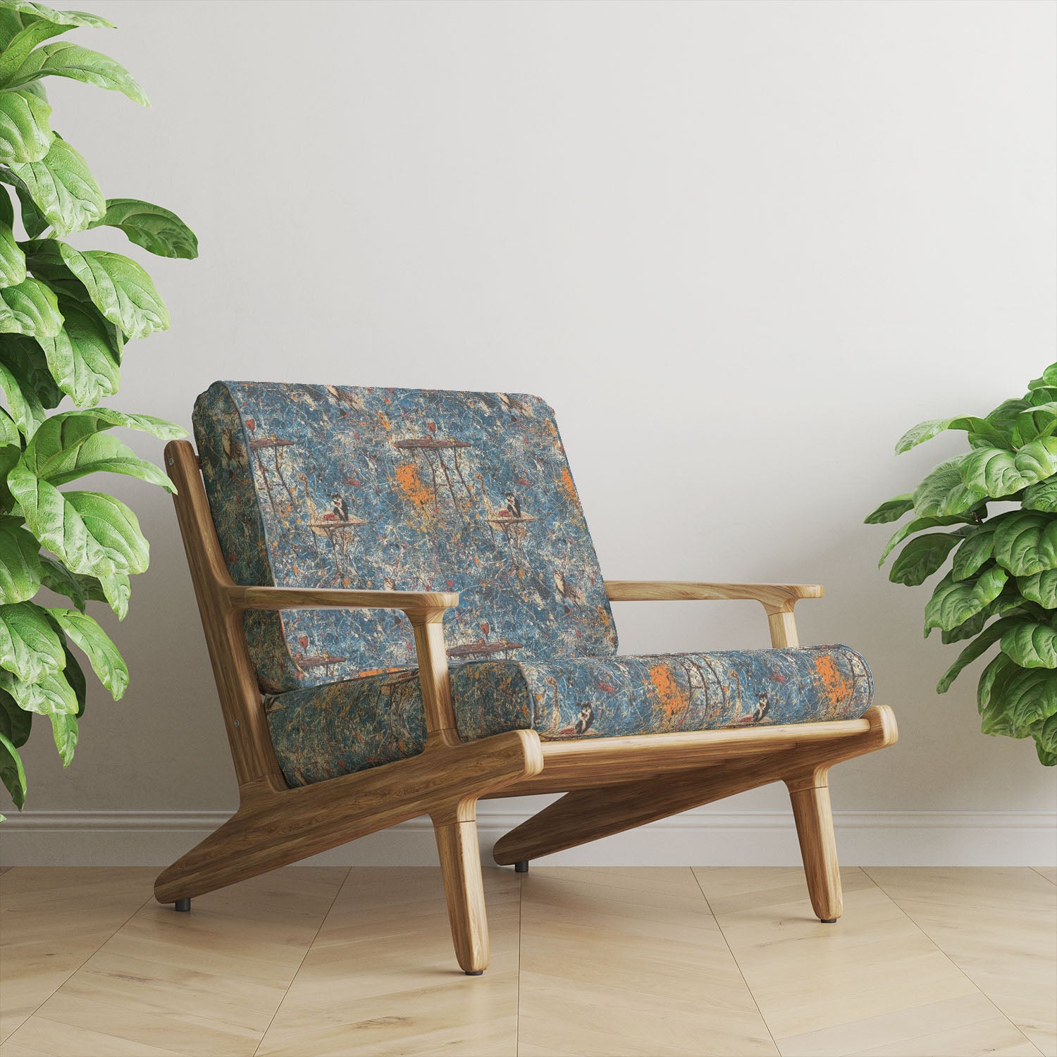 Statement upholstery fabric armchair in blue abstract design with layered paint splatter and illustrative bird and table details