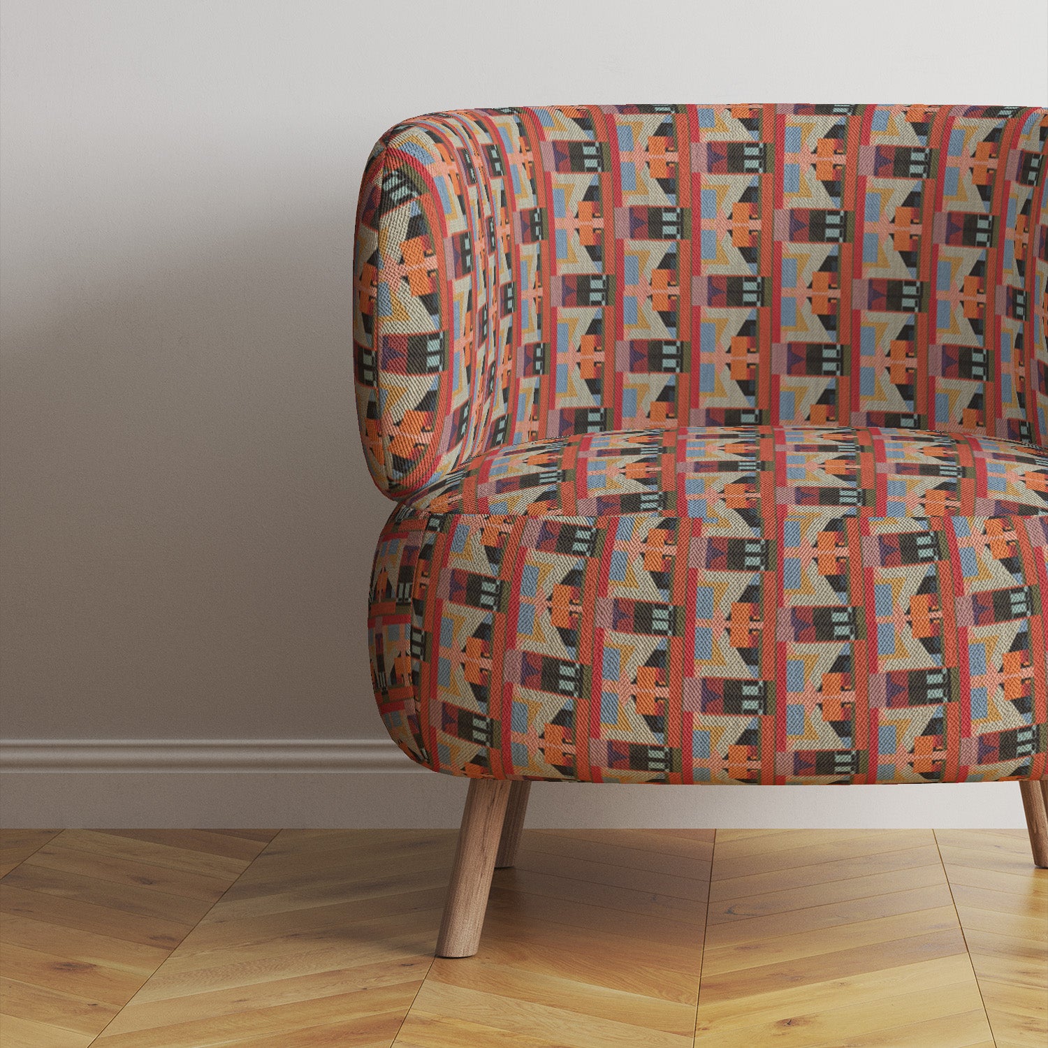 Multicoloured upholstery fabric shown on modern armchair
