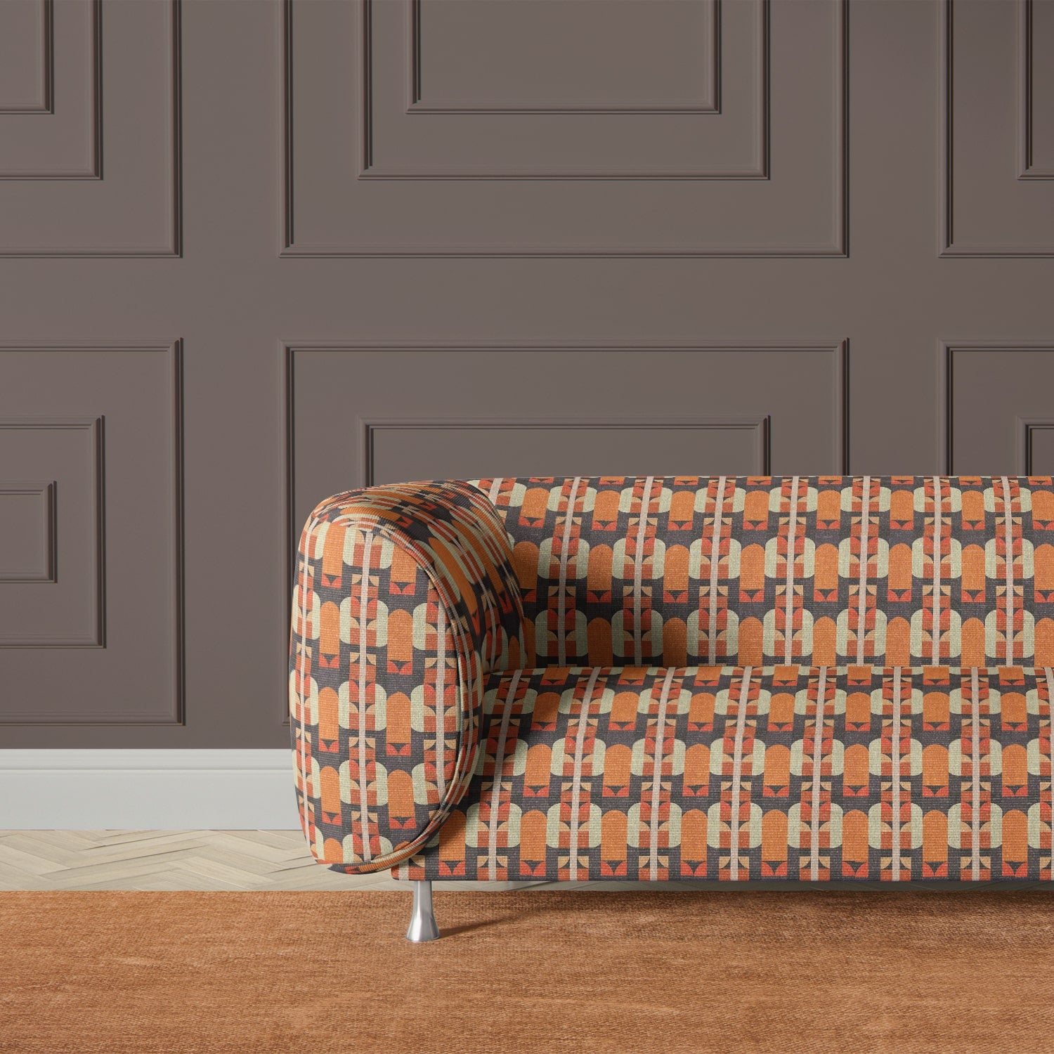 Armchair upholstered in Bauhaus-inspired orange and charcoal upholstery fabric