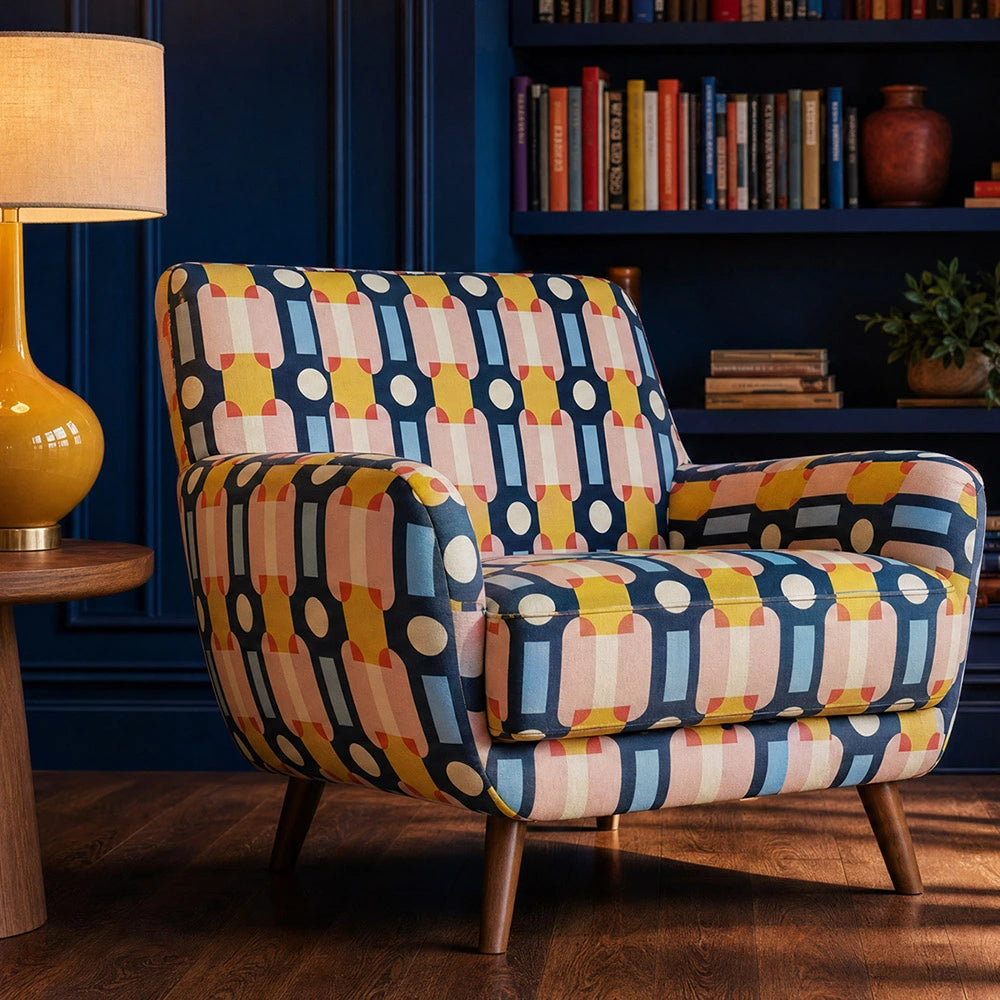 Art Deco inspired upholstery fabric armchair in Weimar No.3 with geometric Bauhaus pattern in pink, navy blue, ochre and cream tones