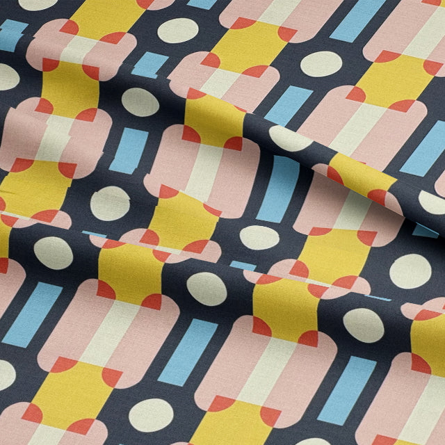 Soft close-up of contract-grade upholstery fabric with pastel pink and blue tones