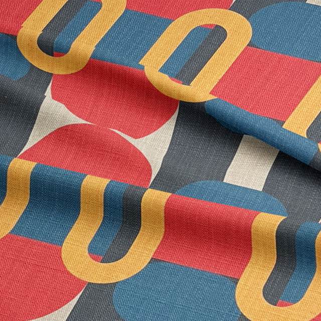 Close-up of modern blue upholstery fabric with circular and oval motifs