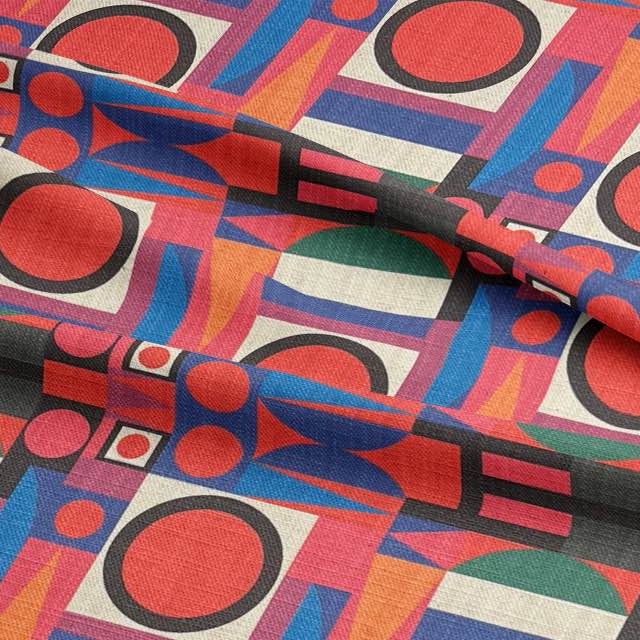 Close-up of structured abstract upholstery fabric in pink, navy and red tones