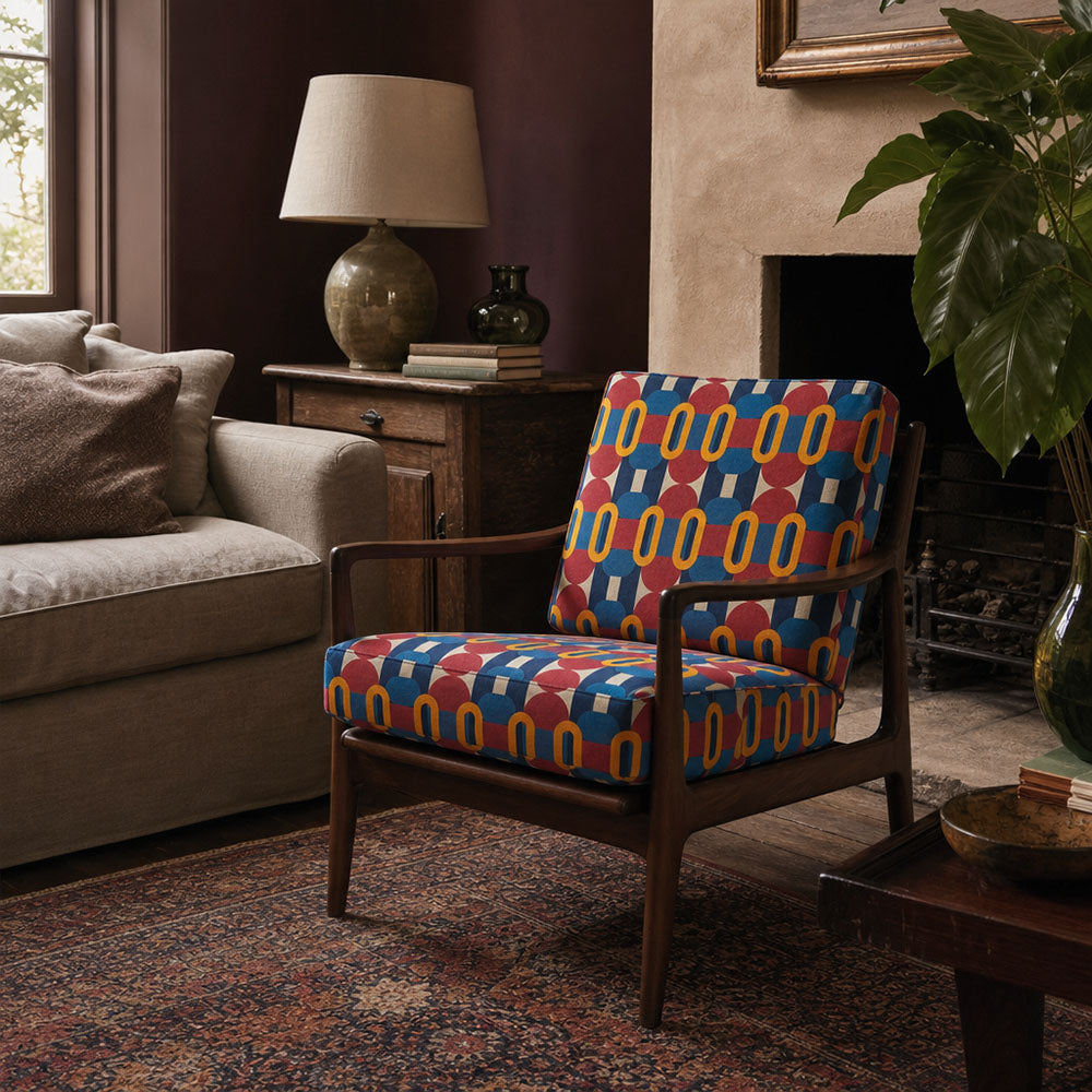 Chair upholstered in Weimar No.5 Crib5 velvet fabric with bold blue geometric design