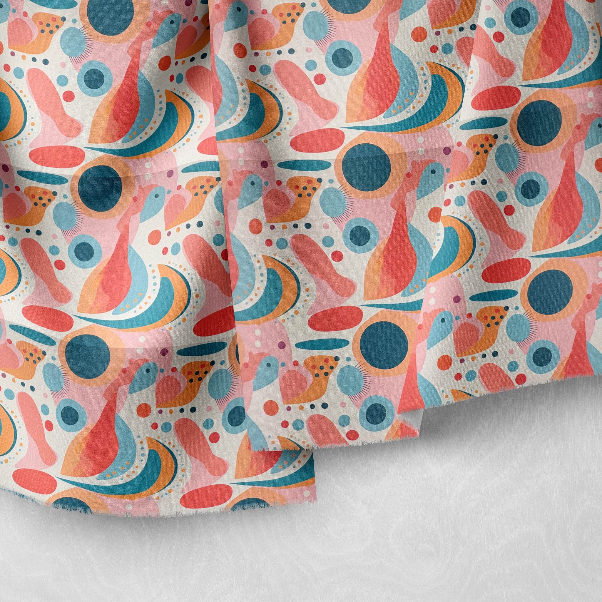 Modern abstract upholstery fabric in coral, blue, and pink