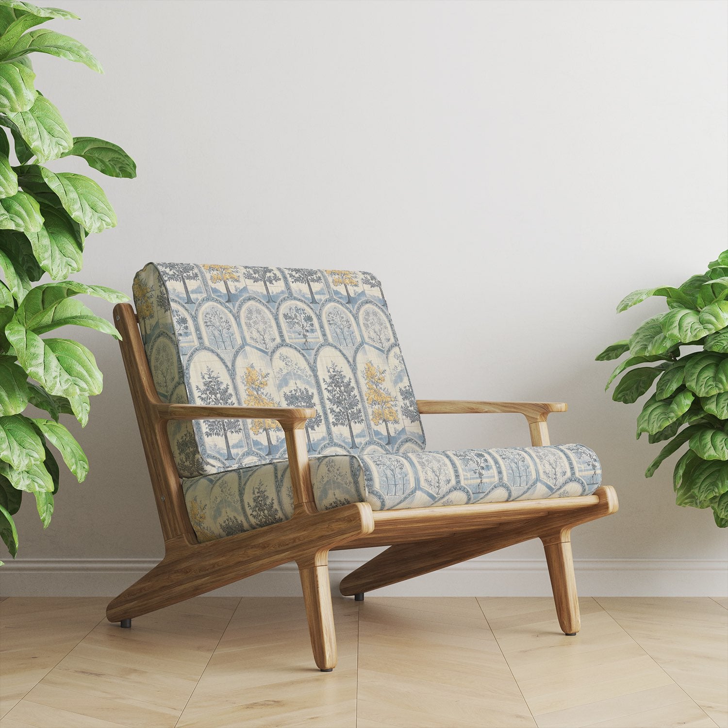 Mid-century chair upholstered in Agra No.5 upholstery fabric with botanical arches and trees in pale blue and ochre tones