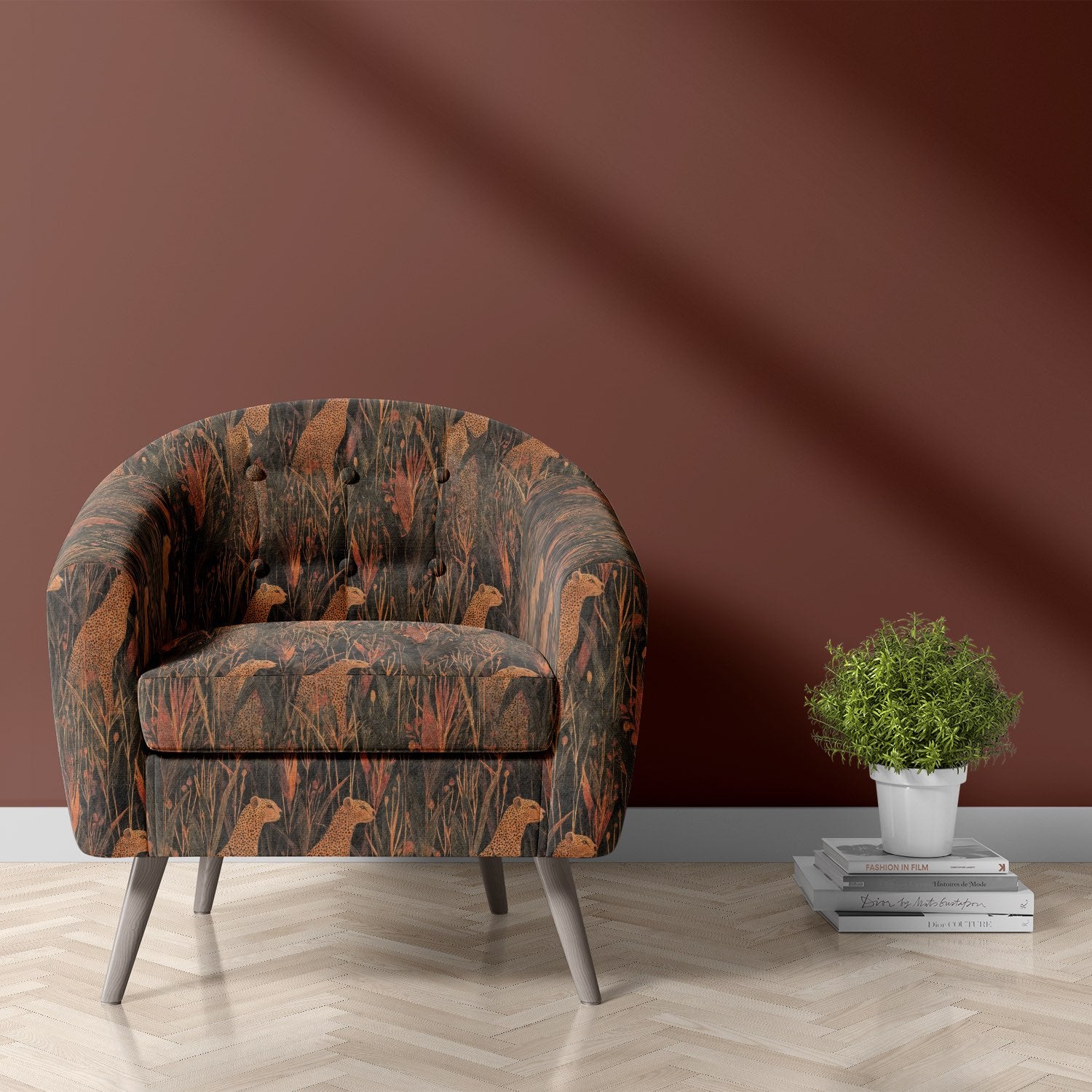 Chair upholstered in Animals No.10 fabric featuring orange cheetahs and dark foliage on pet-friendly upholstery fabric