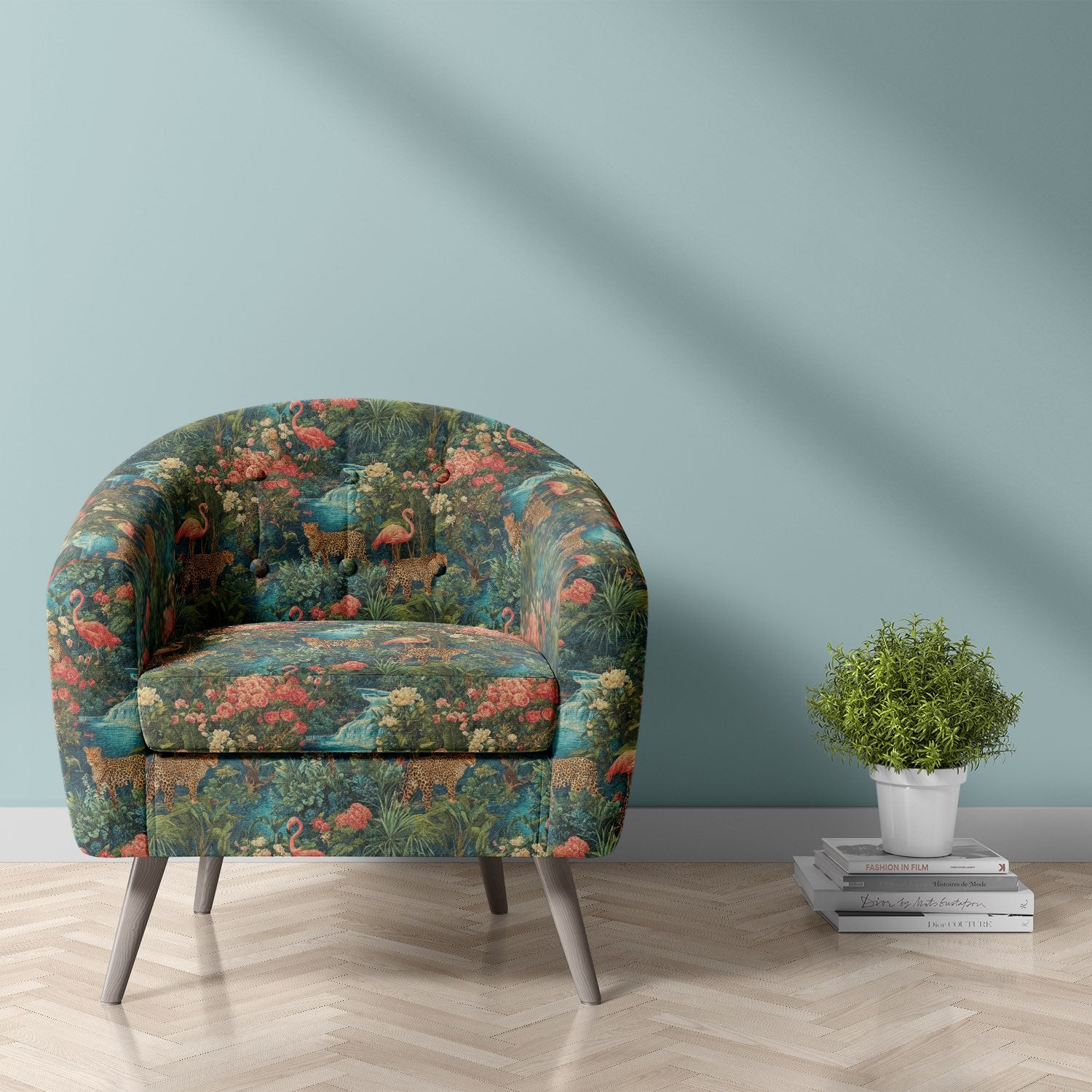 Statement chair upholstered in multicoloured animal upholstery fabric with wildlife and floral jungle design