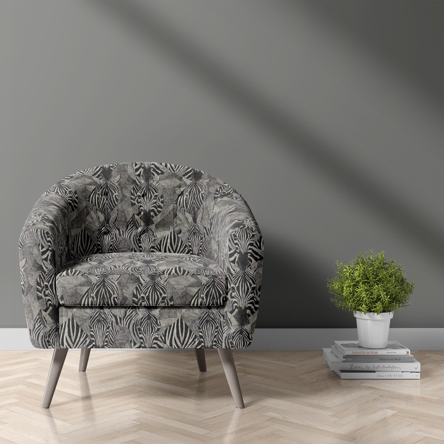 Upholstered chair in zebra print animal upholstery fabric with bold black and ivory tones