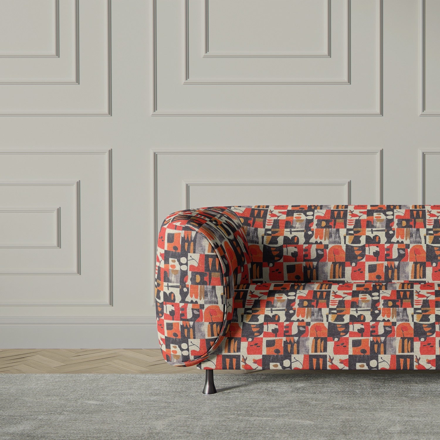 Modern accent Sofa upholstered in Atelier No.1 fabric, showcasing its rich contrast of warm and deep hues with striking geometric detailing.