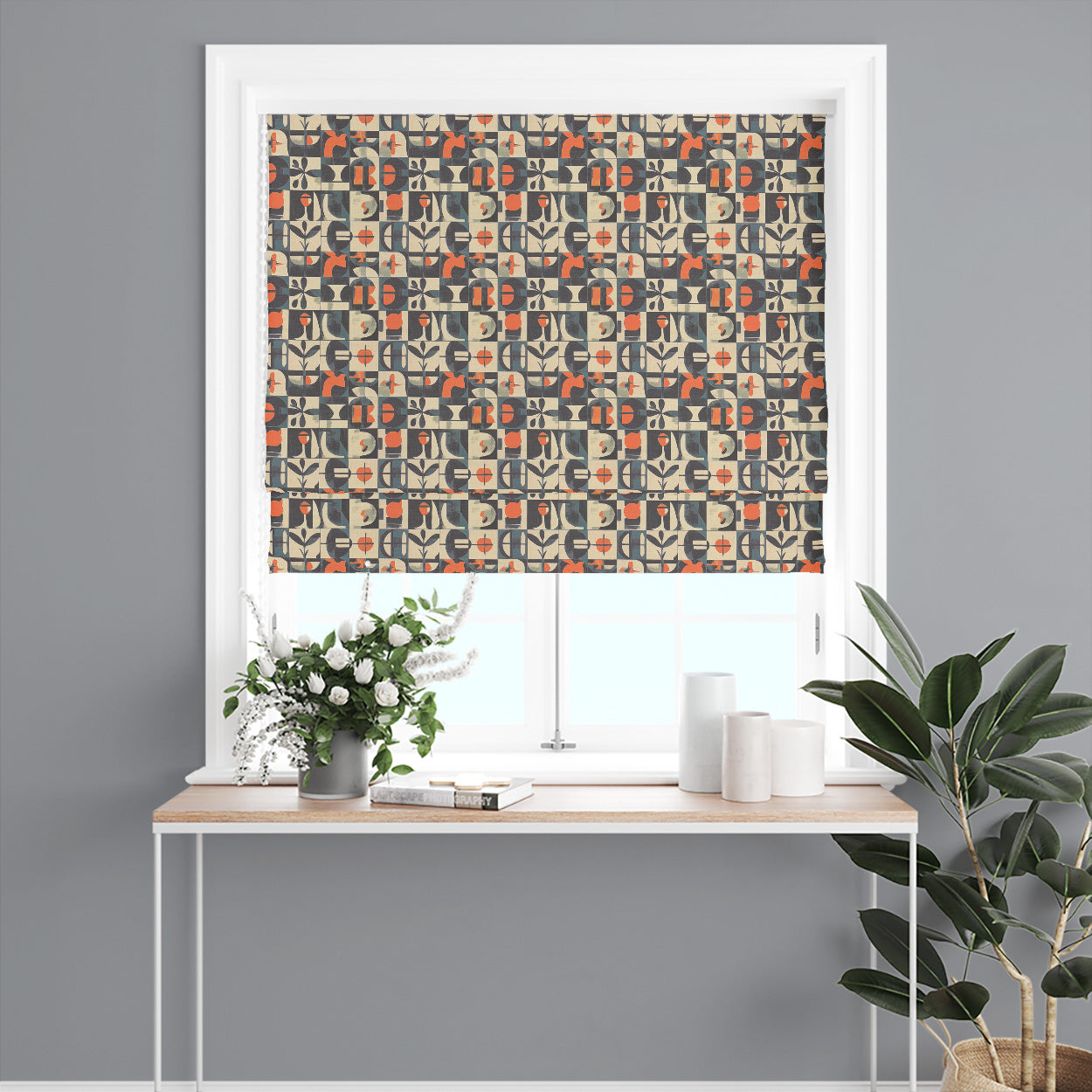 Roman blind made from Atelier No.9 tiled curtain fabric featuring mid-century inspired geometric blocks and sculptural motifs