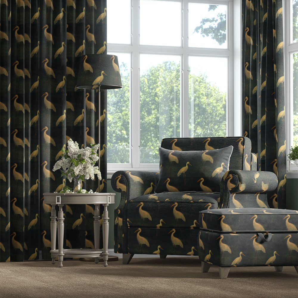 Velvet bird fabric used on armchair and curtains with golden heron pattern on dark green velvet – Aviary No.1 velvet bird fabric