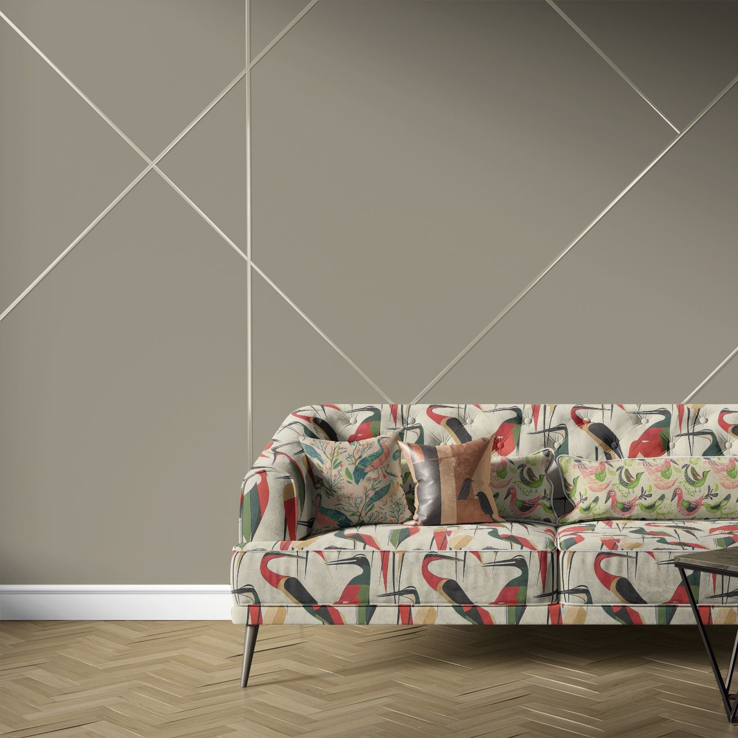 Bird No.33 upholstery fabric on modern sofa with geometric bird design in red, green, ochre, and black.