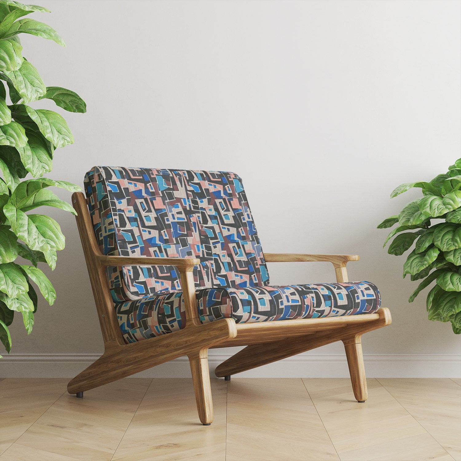 Armchair upholstered in Collage No.10 geometric abstract upholstery fabric.