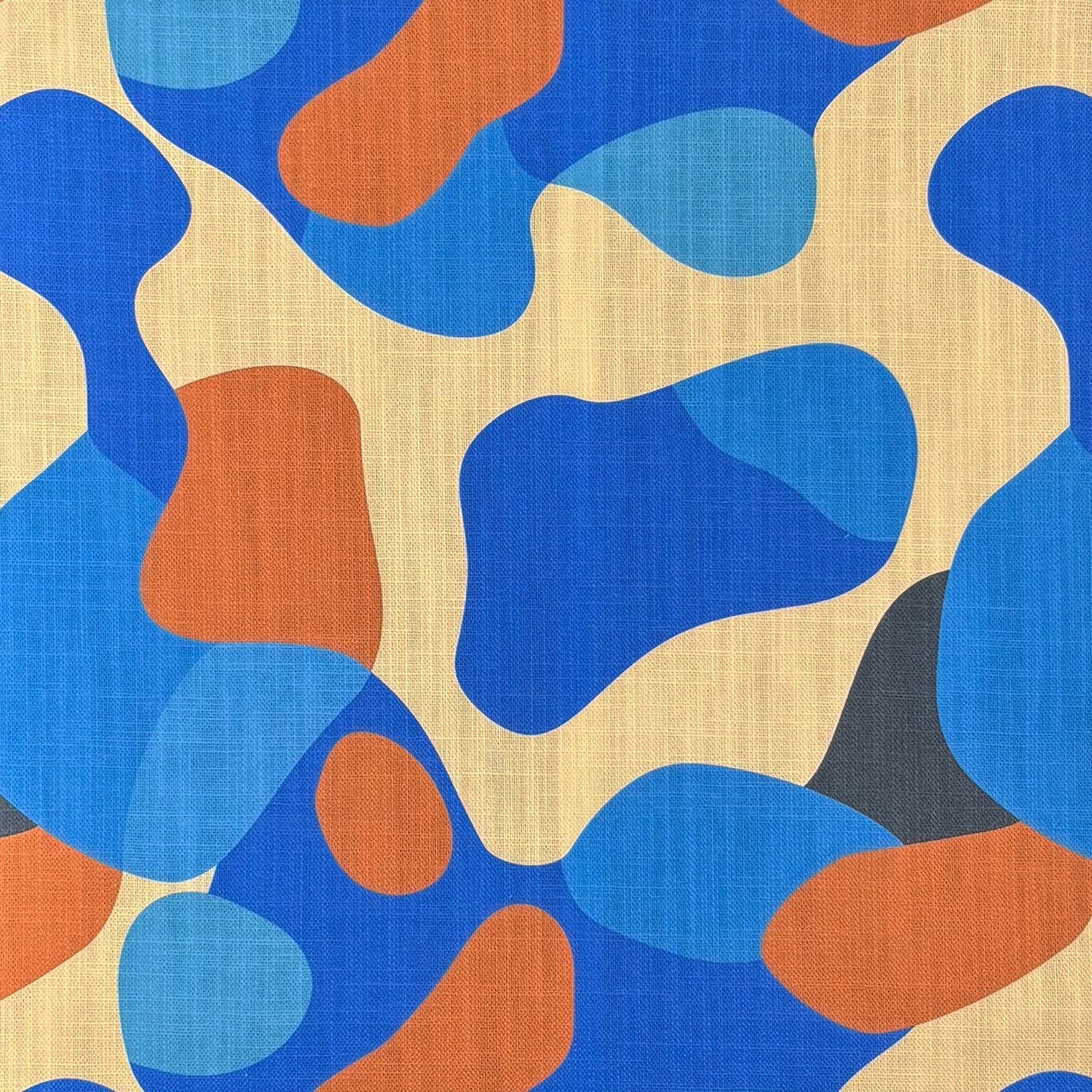 Abstract multicoloured Creation No.13 upholstery fabric in blue, orange, and beige organic shapes.