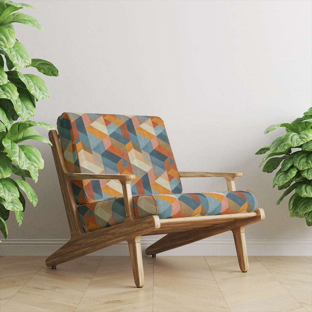 Armchair upholstered in Dessau No.10 upholstery fabric with bold multicoloured geometric design
