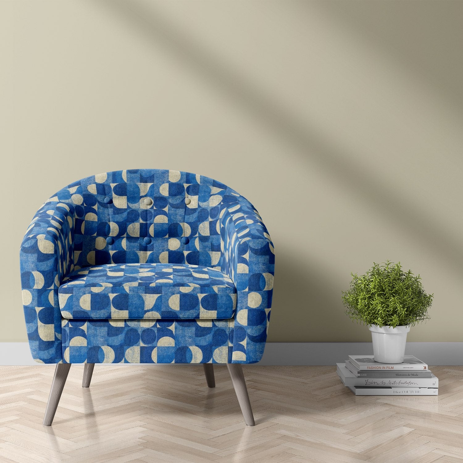 Armchair upholstered in bold blue Bauhaus-style upholstery fabric featuring semi-circles and curves – Dessau No.20