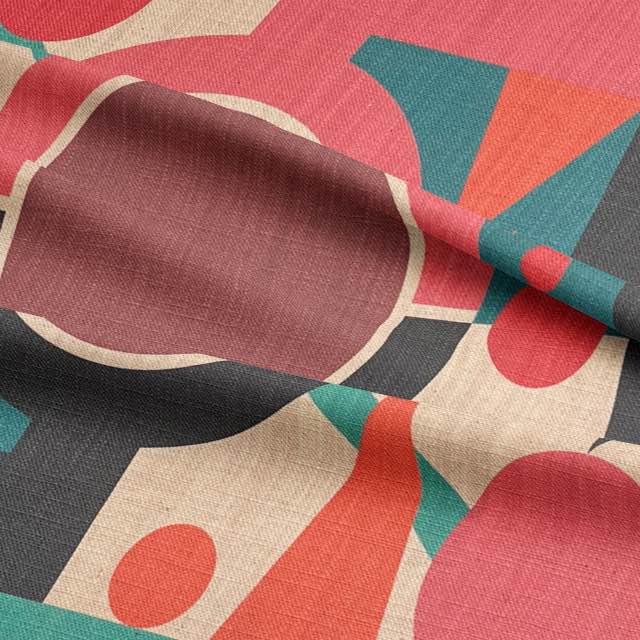 Close-up texture of Estaque No.5 designer upholstery fabric in coral, teal and red with clean geometric forms