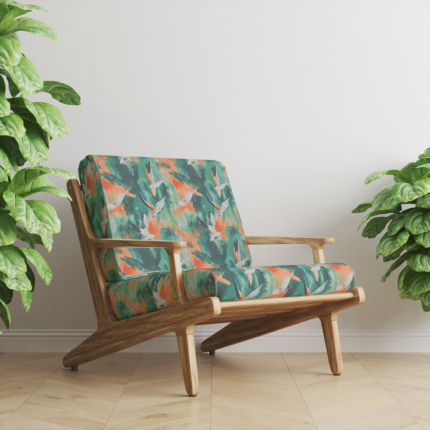 Armchair upholstered in Expressionism No.12 upholstery fabric with painterly bird design in green, orange, and white