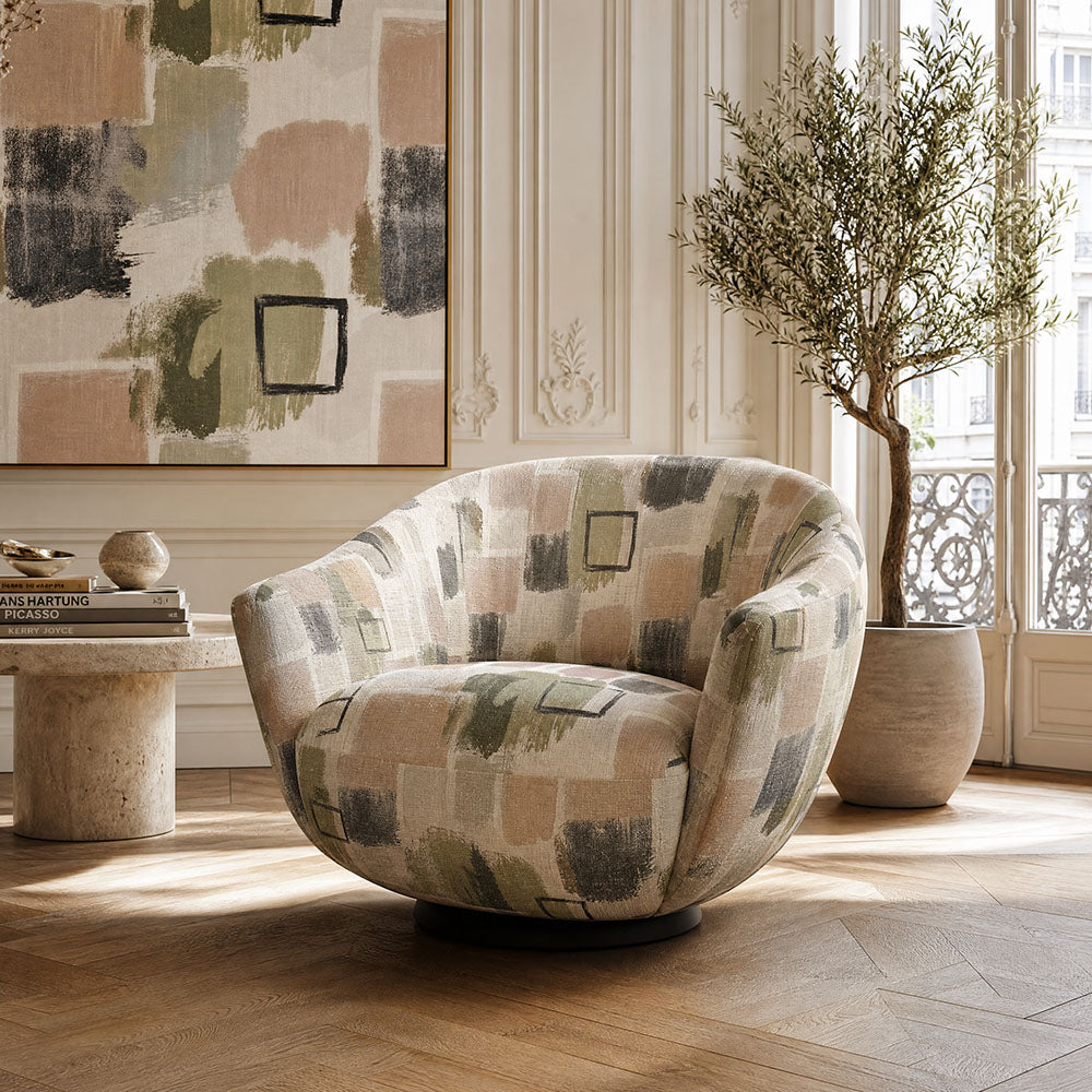 Fauve No.11 sage green and blush pink abstract upholstery fabric on a rounded statement chair
