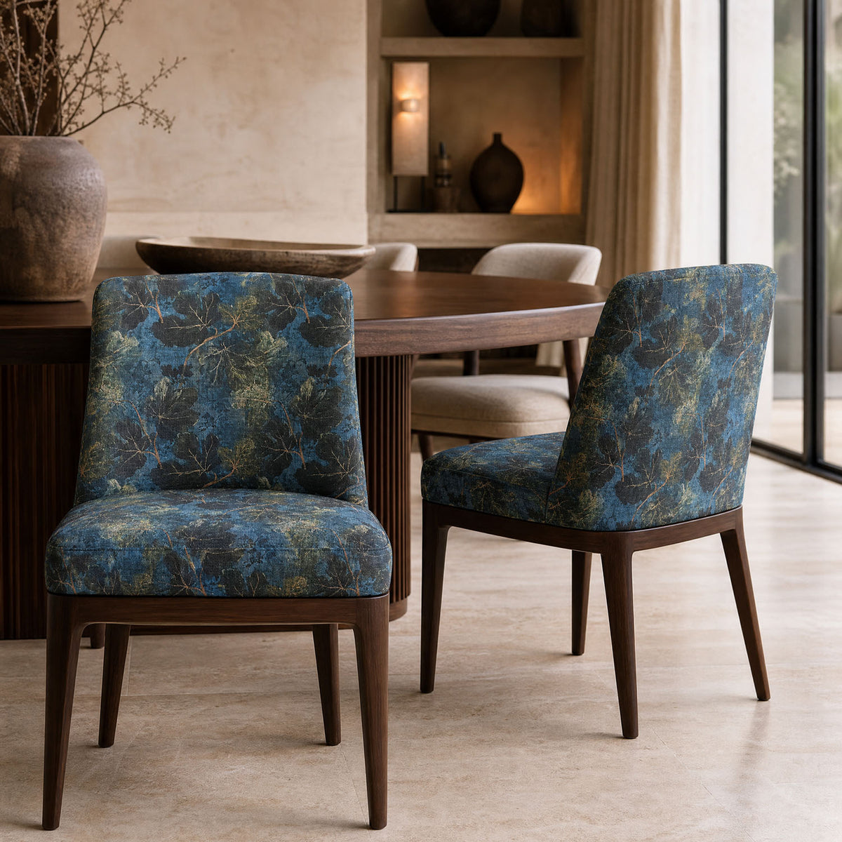 Foliage Leaf No.1 blue green leaf upholstery fabric on a pair of statement chairs