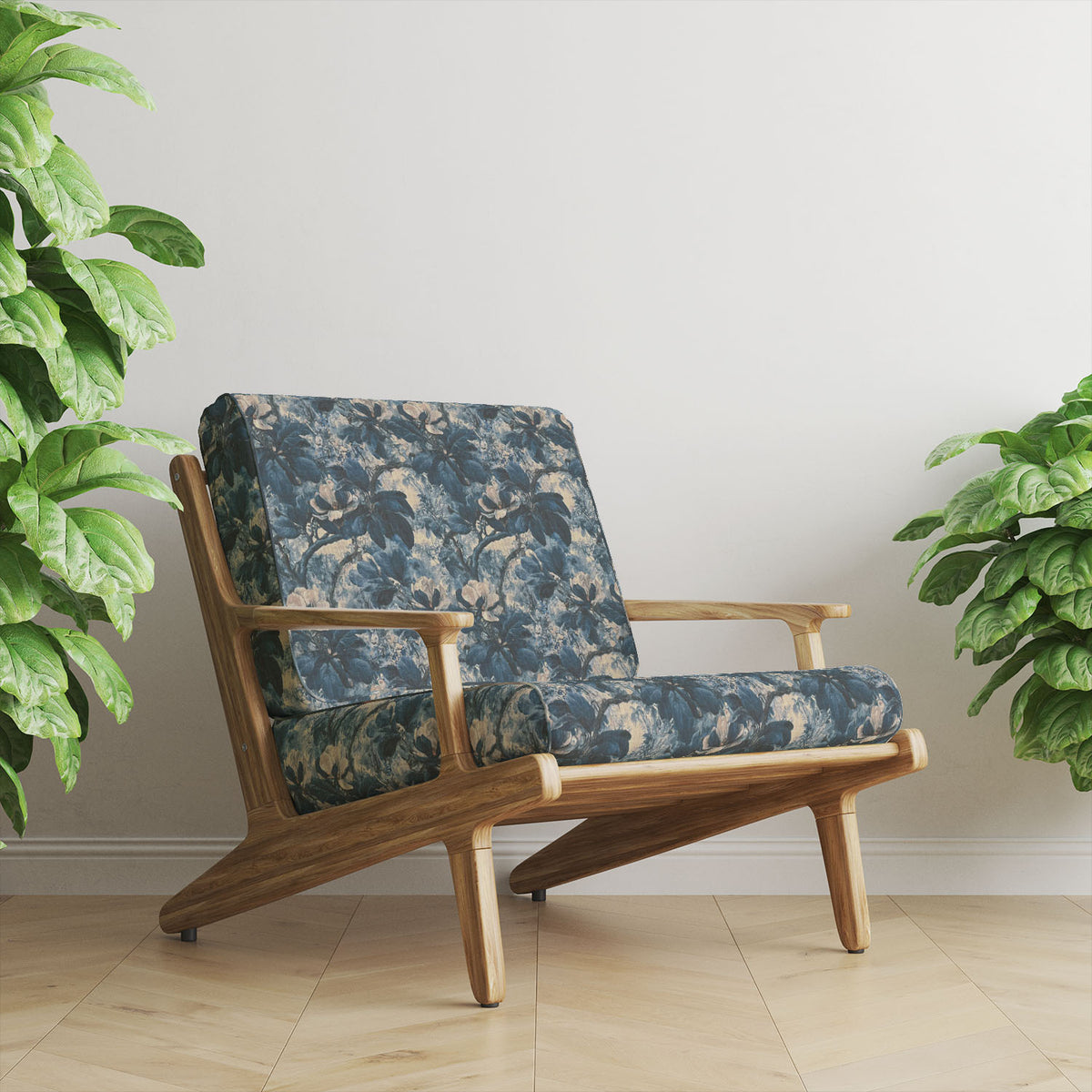 Foliage Leaf No.9 blue floral upholstery fabric displayed on an elegant accent chair