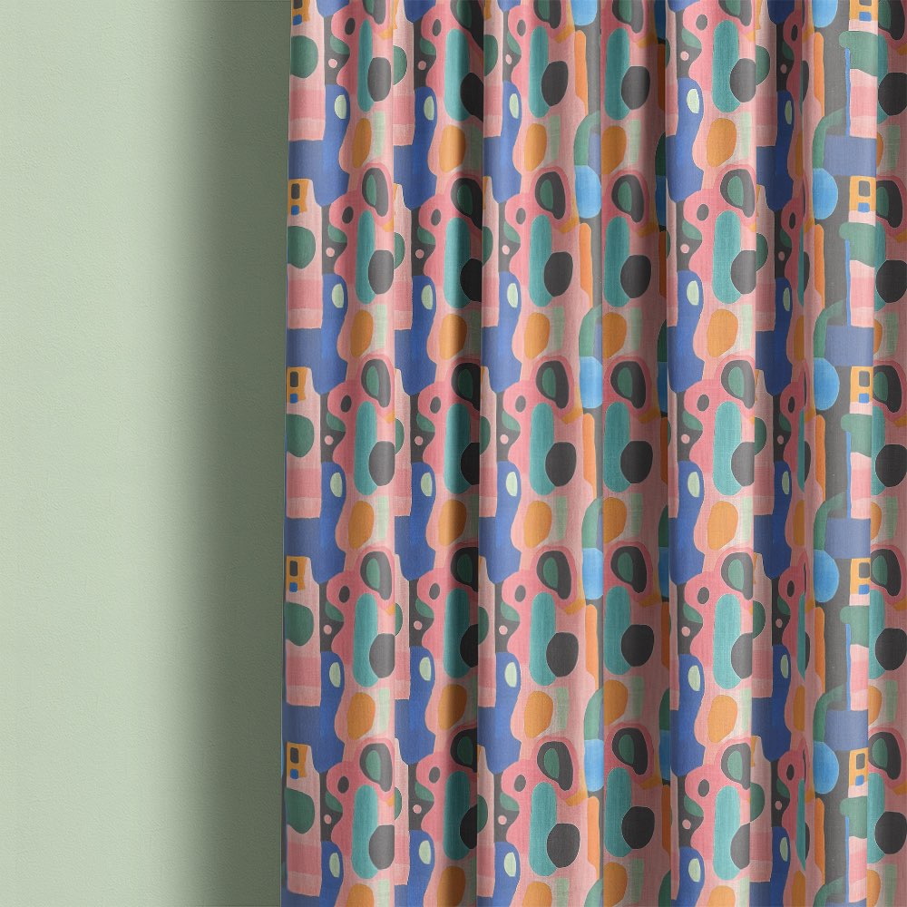 Fresco No.12 curtain fabric styled as full length curtains with colourful geometric pattern and soft pastel palette