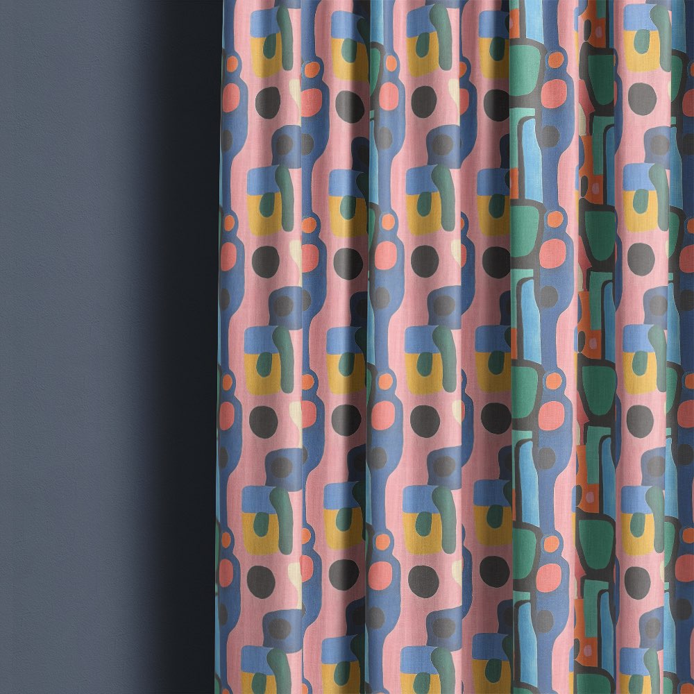 Fresco No.14 curtain fabric made into full-length curtains showing pastel Bauhaus pattern in modern interior setting