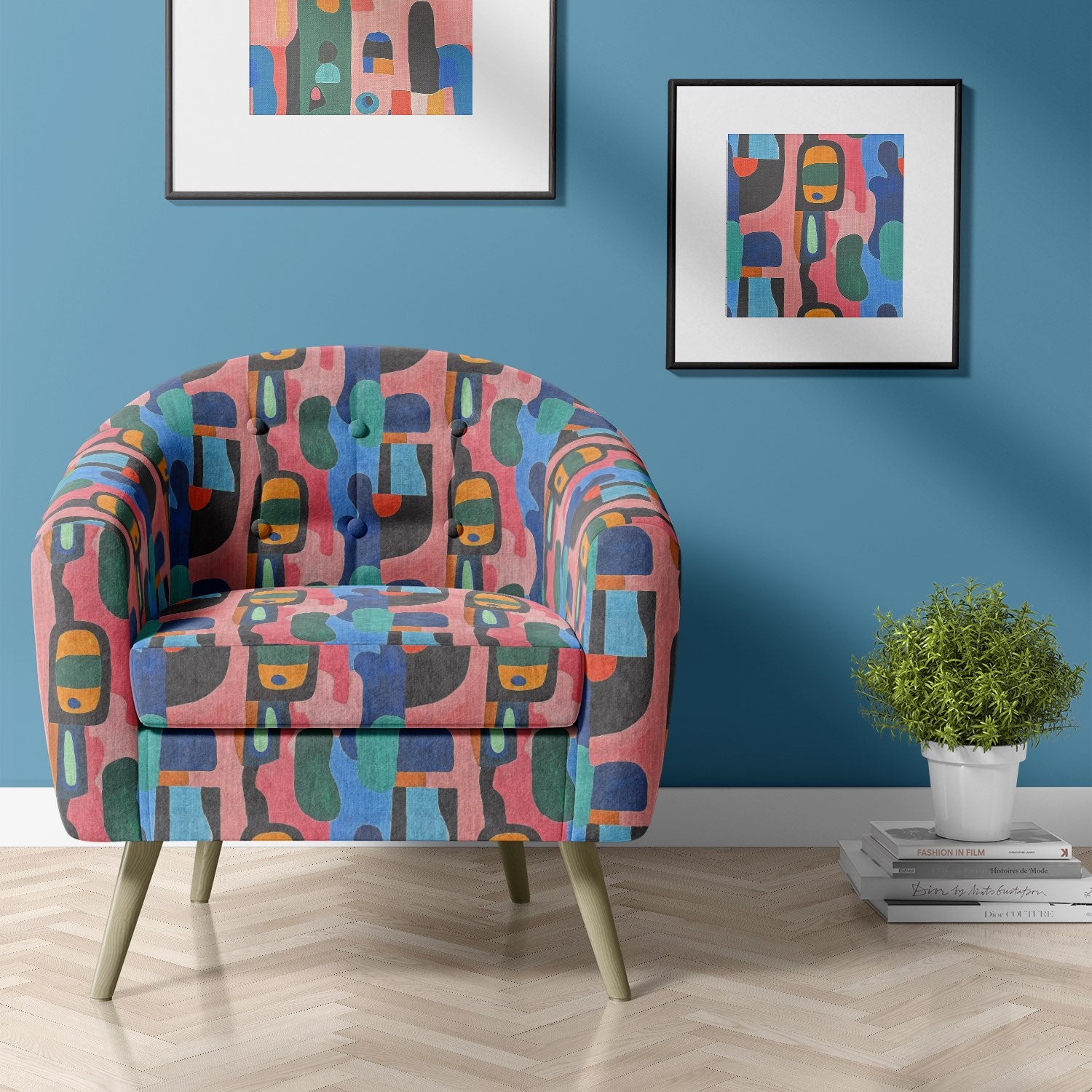 Upholstered barrel armchair in Fresco No.21 multicoloured upholstery fabric in a blue-toned living room
