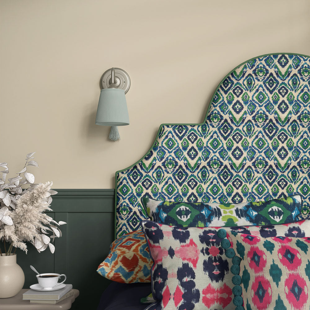 Headboard covered in Kilim No.24 Crib5 velvet, showing a blue, green and navy Kilim design for statement upholstery