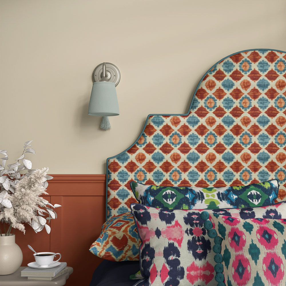 Headboard upholstered in Kilim No.26 Crib5 velvet, pairing terracotta and teal in a bold Kilim design