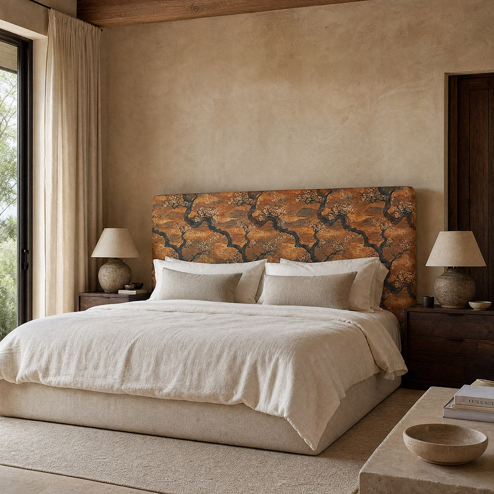 Kintsu No.15 orange Japanese blossom upholstery fabric styled across a statement headboard