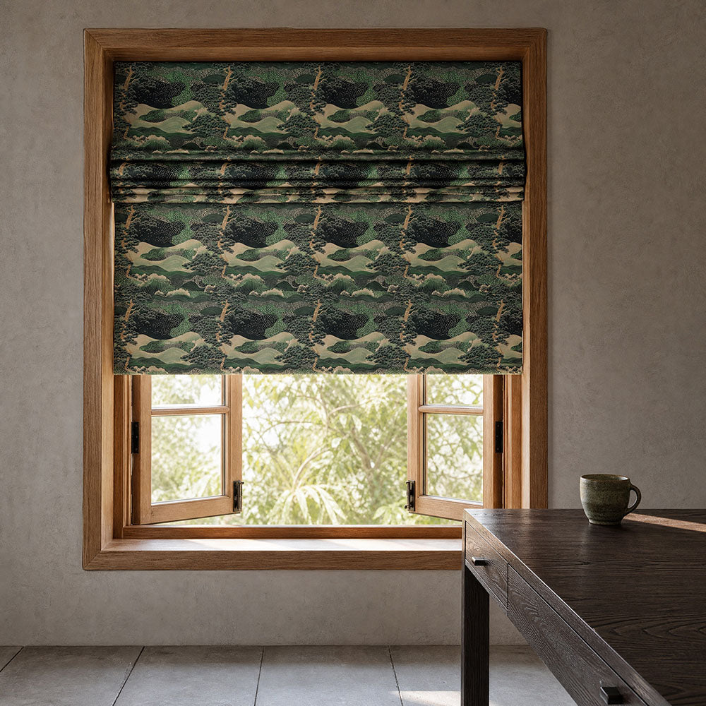 Japanese inspired Roman blind featuring scenic landscape fabric with flowing waves, rolling hills and woodland motifs in emerald green, sage and ivory tones fitted within a contemporary timber-framed window