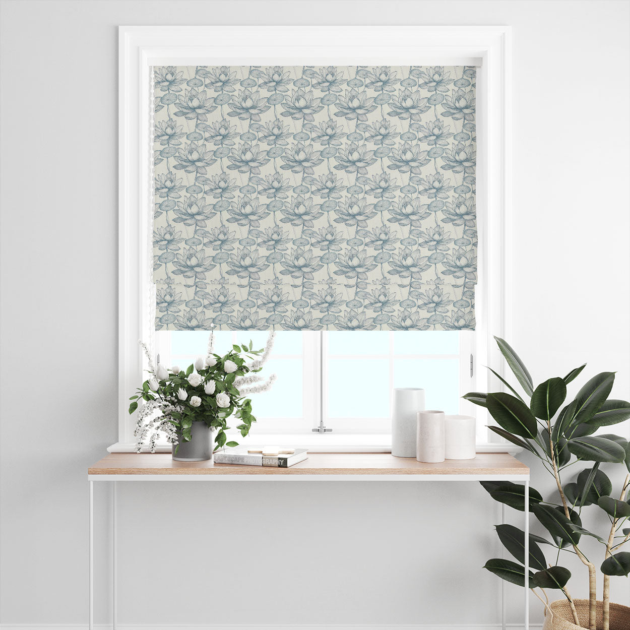 Lotus No.10 pale blue floral linen curtain fabric shown as a Roman blind