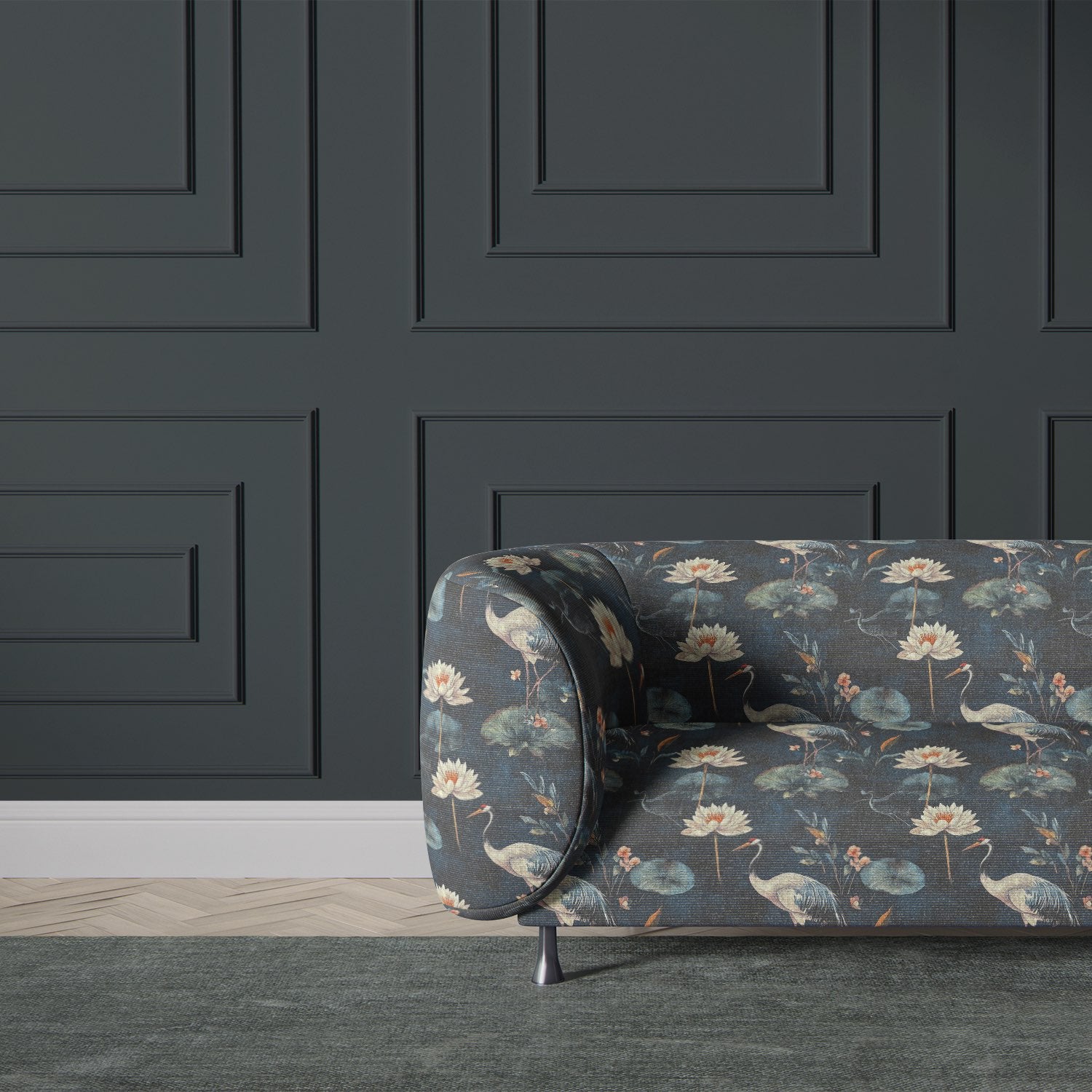 Upholstered sofa in Lotus No.1 floral upholstery fabric showing painterly crane and waterlily design