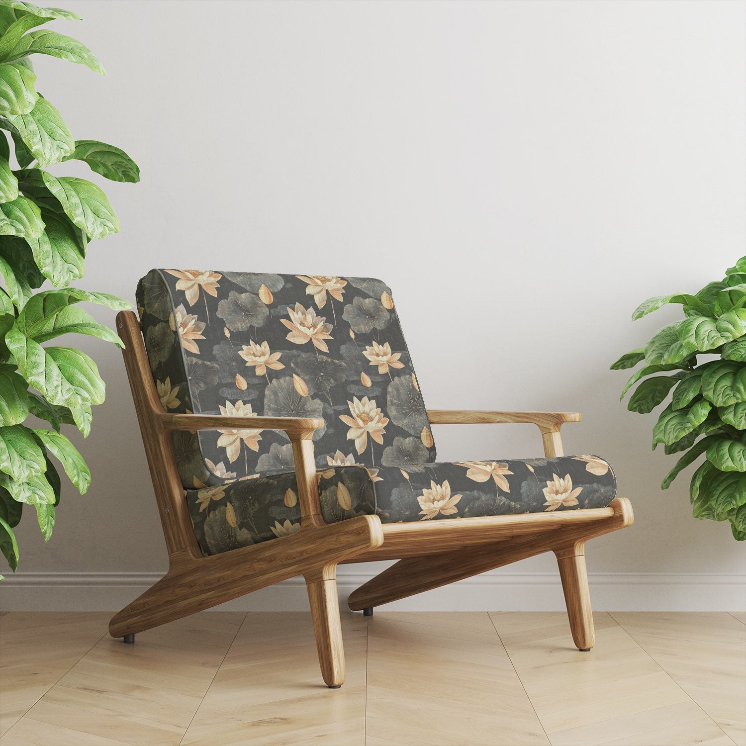 Mid-century armchair upholstered in Lotus No.6 floral upholstery fabric with charcoal background