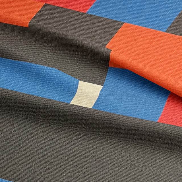 Close-up of modern upholstery fabric with structured abstract shapes and colour blocks