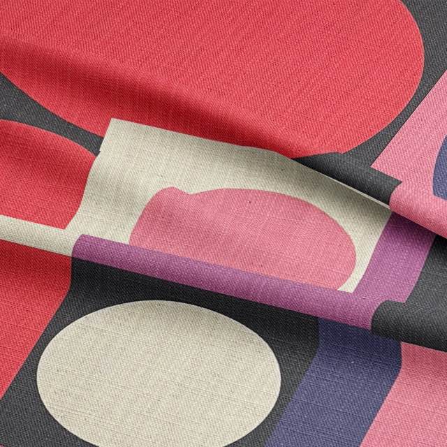 Close-up of statement pink upholstery fabric with Bauhaus-inspired abstract shapes