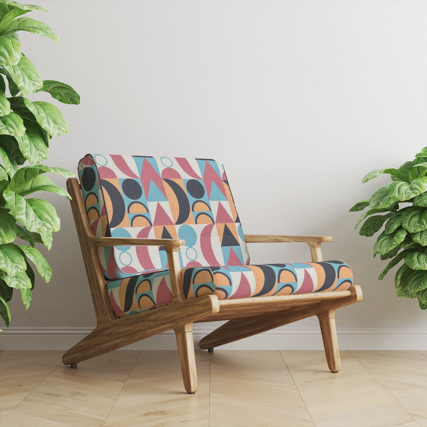 Armchair upholstered in Malaga No.26 cubist geometric upholstery fabric with bold shapes and colours