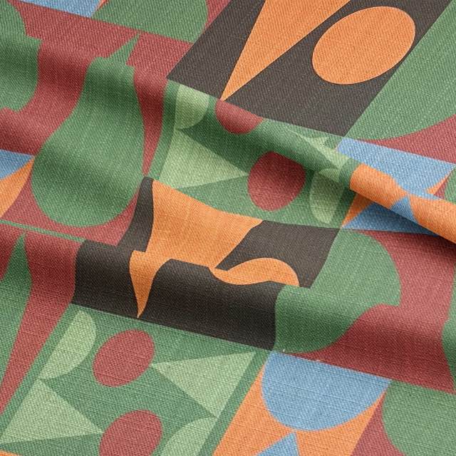 Close-up of abstract upholstery fabric with playful curves and pointed forms
