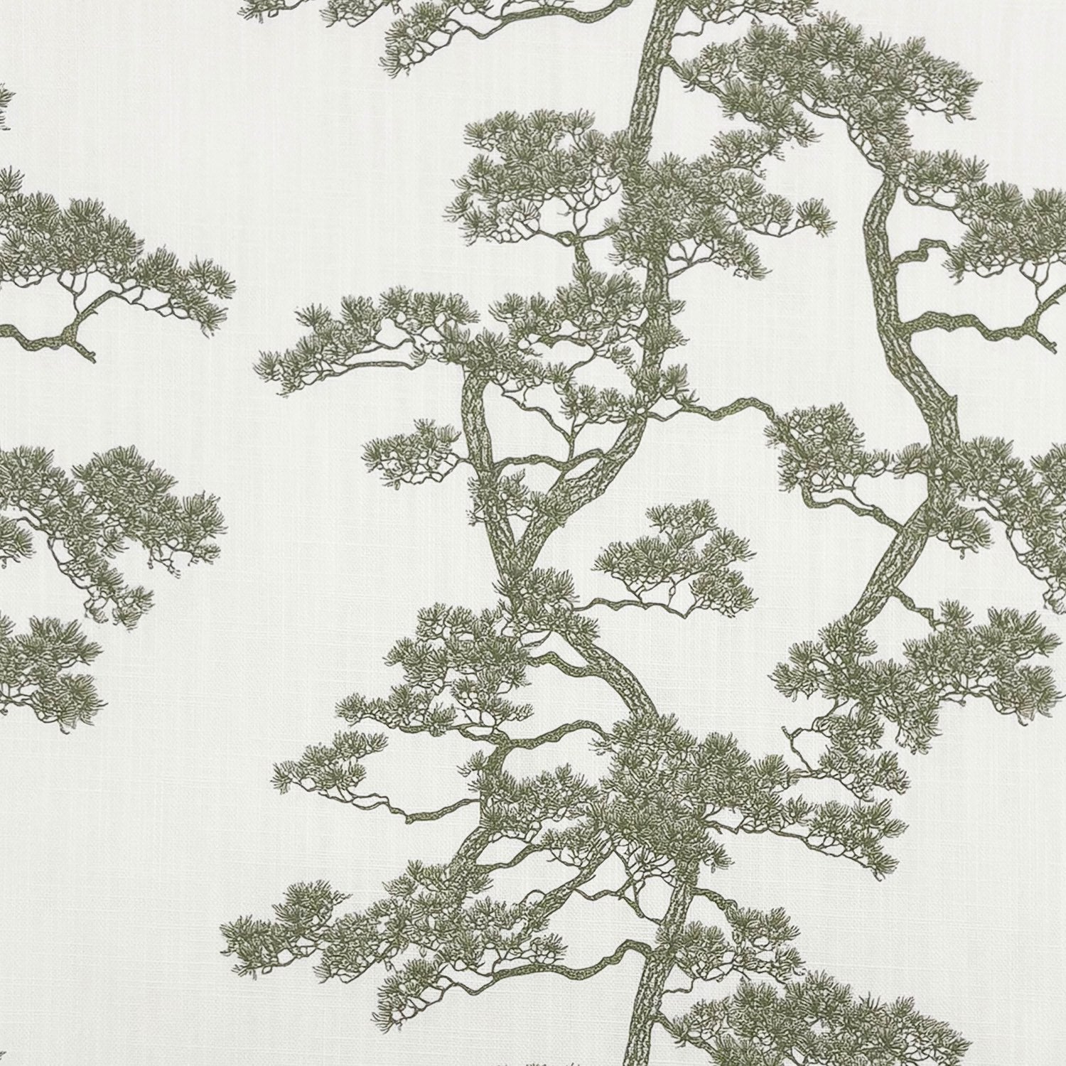Close-up of Mori No.11 linen-blend Japanese upholstery fabric showing detailed green branches on cream background