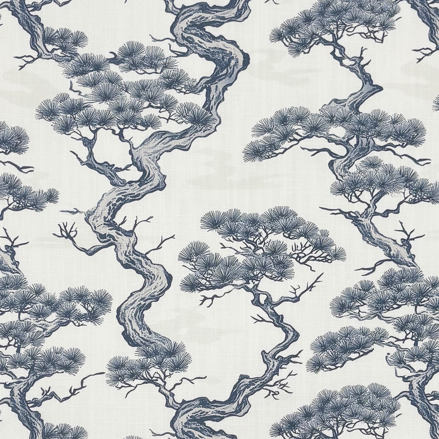 Close-up of Mori No.13 Japanese upholstery fabric with indigo tree design on off-white base