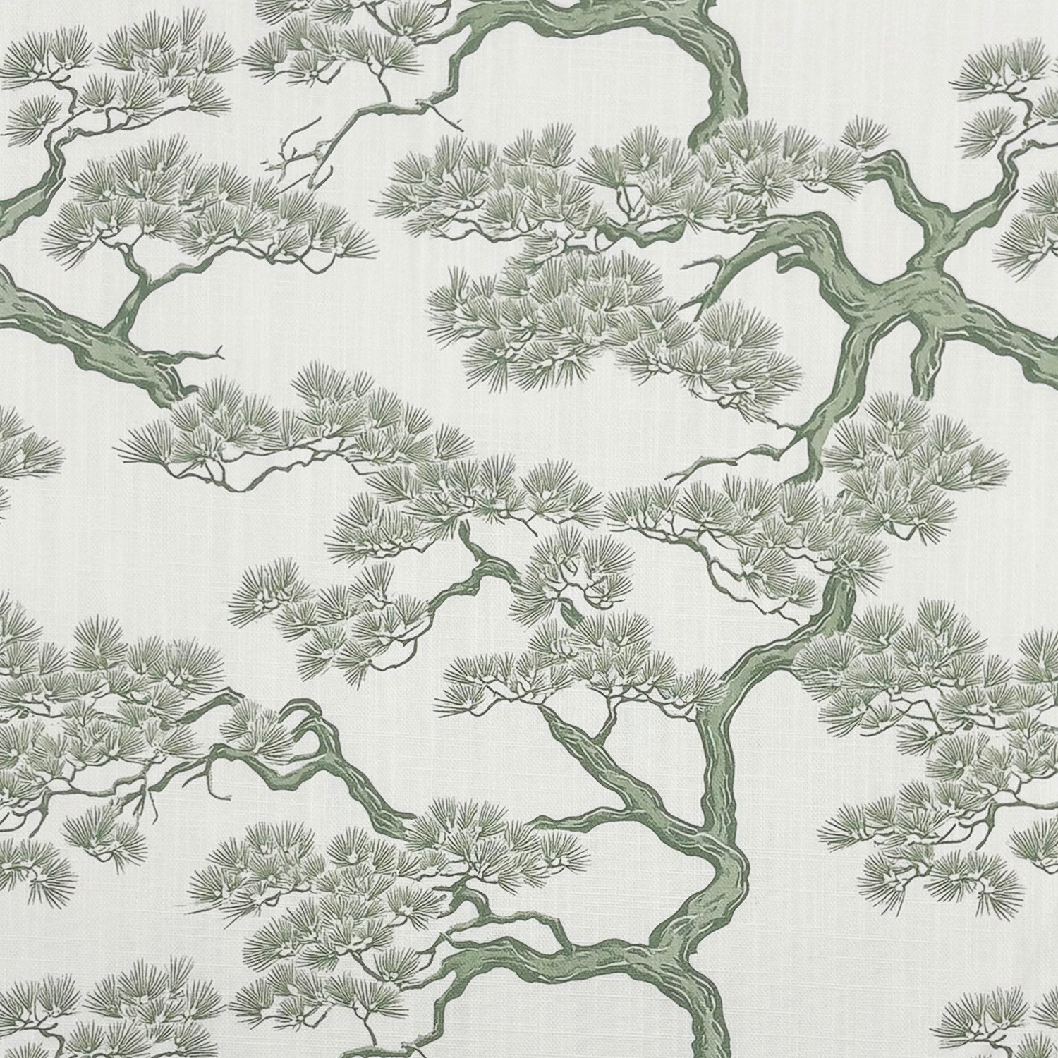 Close-up flatlay of Mori No.14 upholstery fabric showing soft green bonsai-style pattern