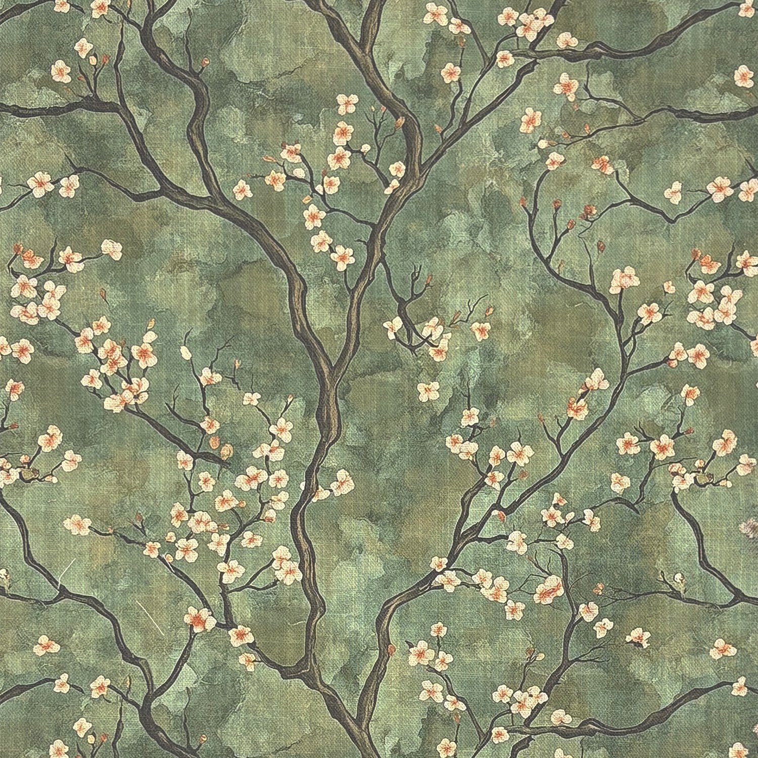 Flat lay of Mori No.17 upholstery fabric – green background with peach blossom branches