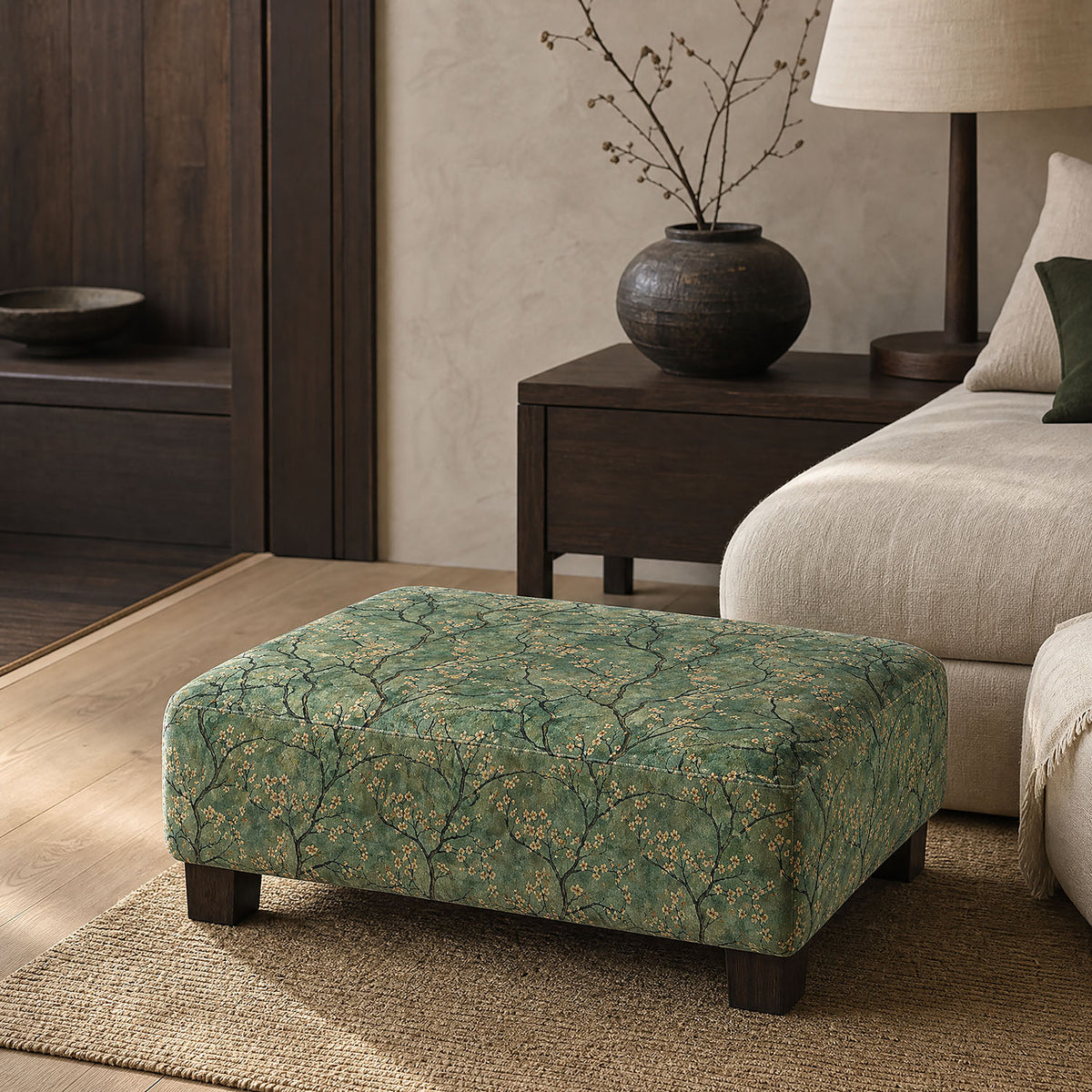 Mori No.17 green blossom Crib5 velvet fabric styled on a footstool