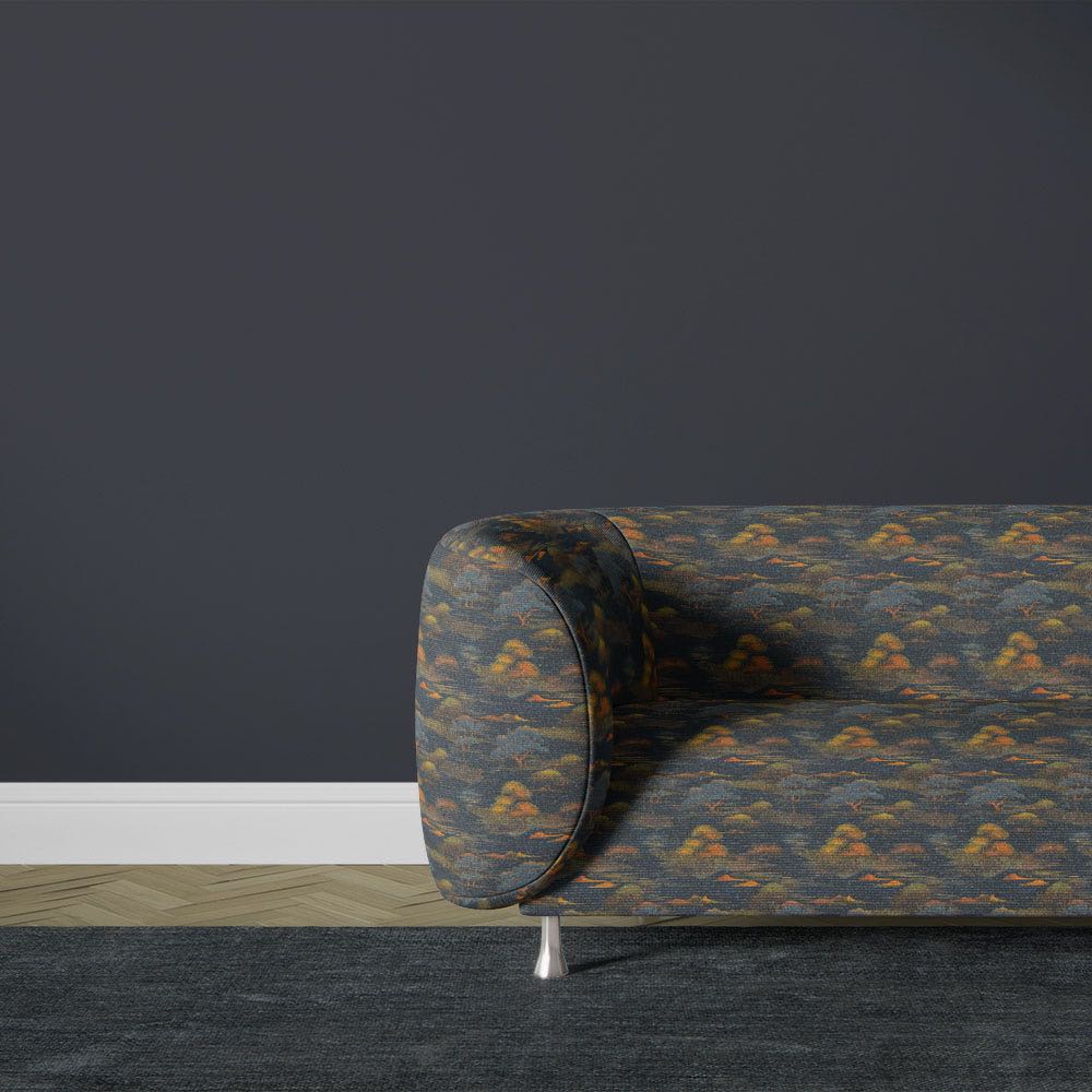 Blue Japanese upholstery fabric sofa with tonal landscape pattern and subtle tree detailing in modern interior