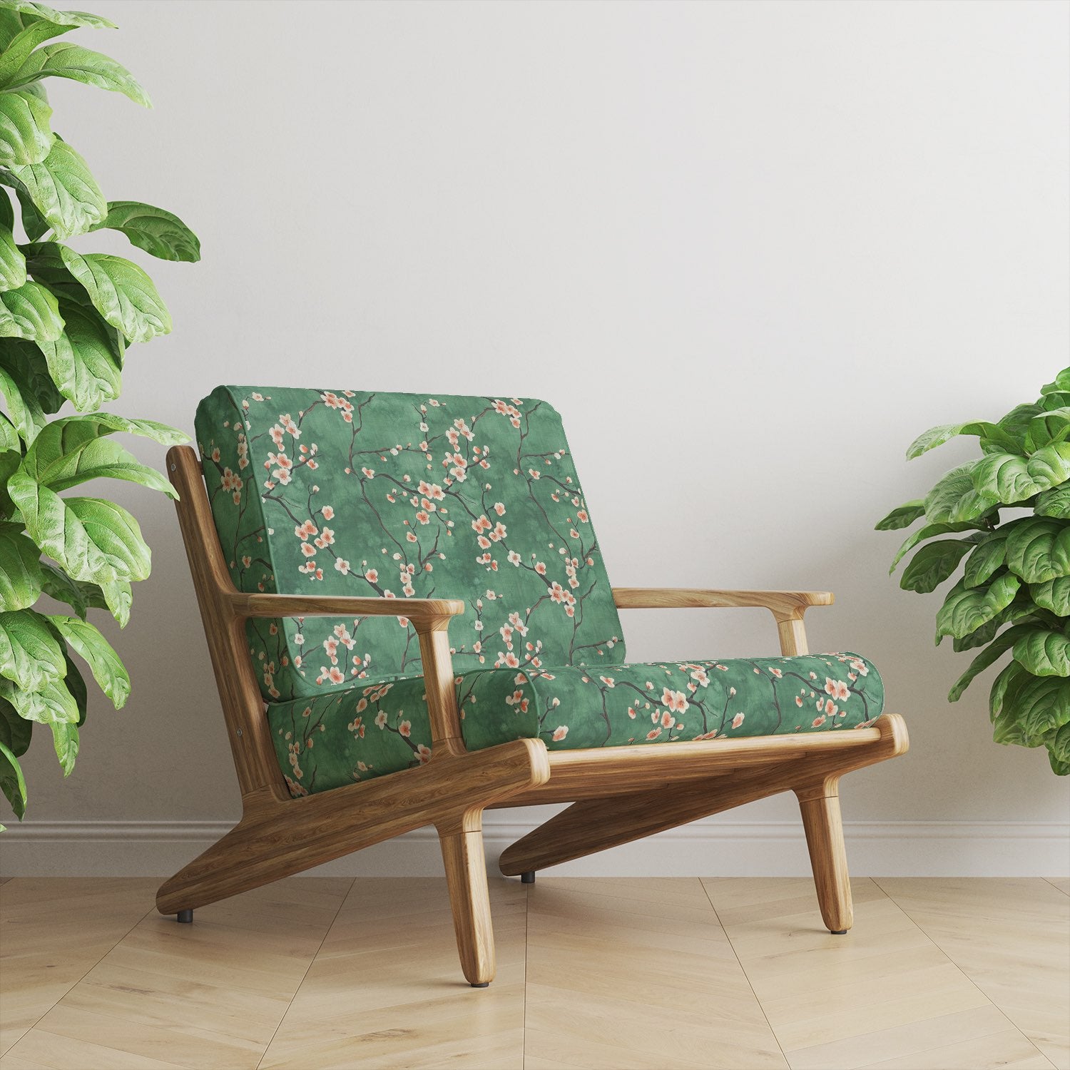 Upholstered lounge chair in Mori No.5 green floral upholstery fabric with blossom pattern.