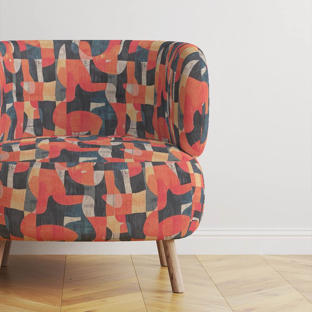 Movements No.5 styled on accent chair – bold orange and navy curved pattern upholstery fabric 