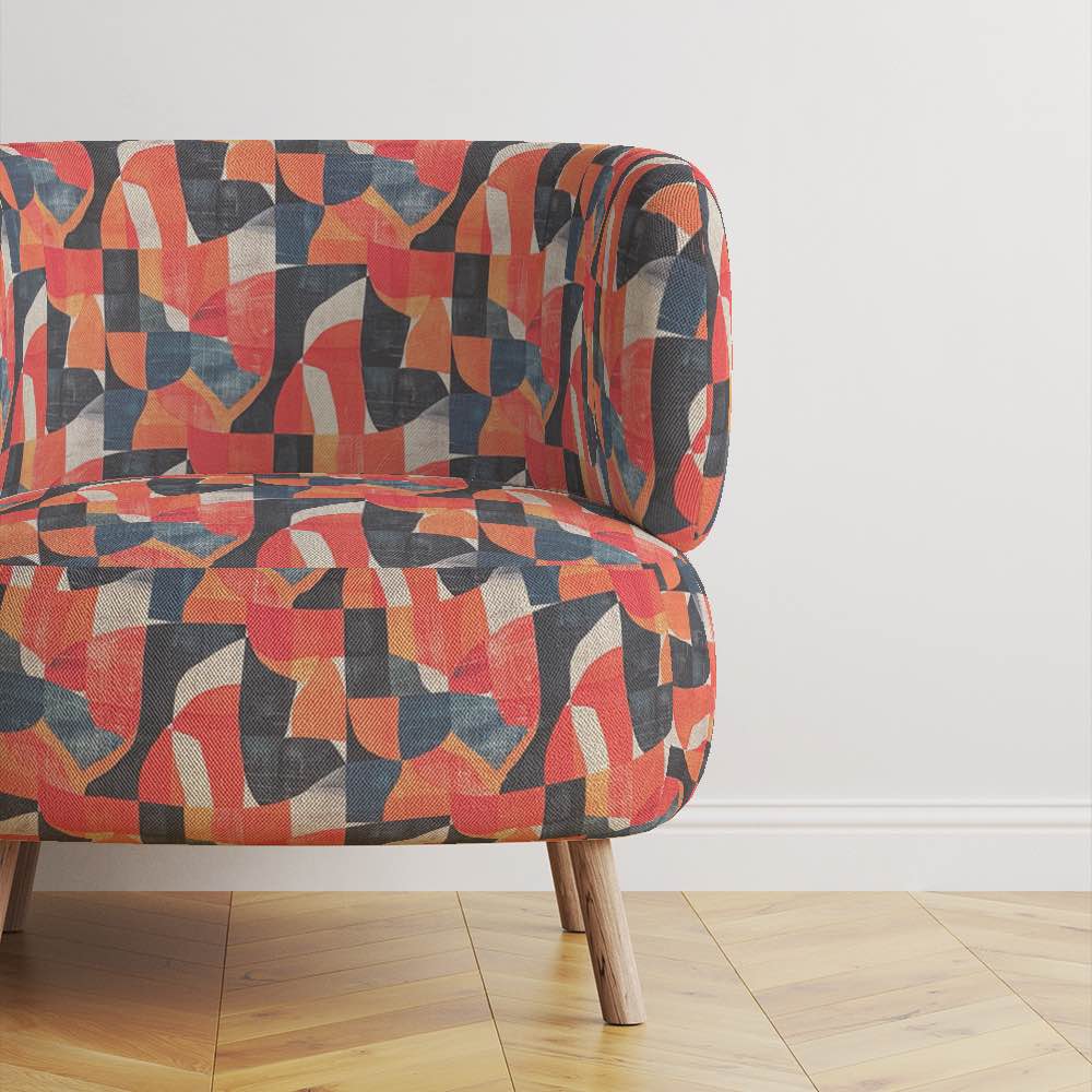 Bold statement armchair upholstered in Movements No.8 orange abstract fabric